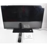 A Hitachi 32" Colour TV with Remote and Manual