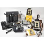 A Collection of Various Vintage Cameras and Binoculars
