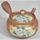 A Chinese Terracotta Side Pouring Teapot with Partial Glazed Enamel Decoration to Lid and Body,