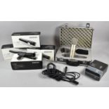 A Collection of Microphones to Include Two Shure SM57 with Pouch and Grip, Two Empty SM57 Boxes,
