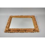 A Modern Carved Wooden Framed Wall Mirror, 50cm wide