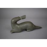 An Inuit Carved Study of an Otter with Fish in Mouth, Inscribed Collectors No.76 to Base, 14cm Long