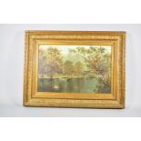 A Late 19th/Early 20th Century Gilt Framed Oil on Board Depicting Punt with Figure on Wooded Pond,