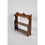 An Edwardian Mahogany Three Tier Open Bookcase with Fretwork Supports, One Corner AF, Galleried Top,