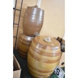 Three Treacle Glazed Stoneware Barrels, One with Tap, Largest 37cm high and 32cm Diameter