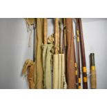 A Collection of Eight Various Fishing Rods, Some with Canvas Bags
