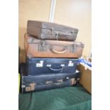 A Collection of Four Vintage Suitcases