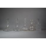 A Collection of Two Ships Decanters, One Spirit Decanter, Claret Jug and Globe and Stalk Decanter