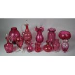 A Collection of 12 Pieces of Cranberry Glass to include Cordial Jug, Vases, Ovoid Vase Etc