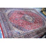 A Large Pattern Woollen Carpet Square on Red Ground, 400x296cm