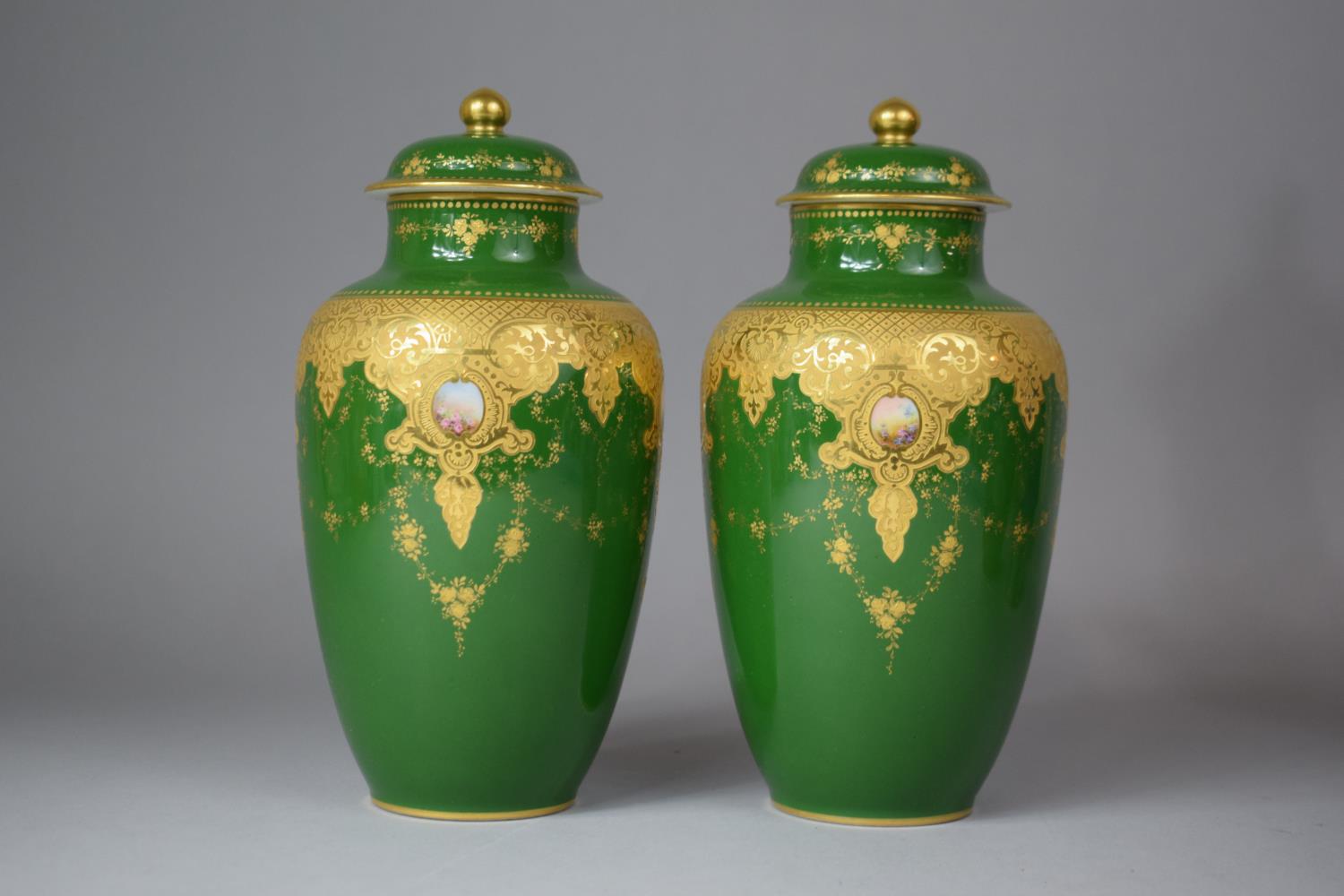 A Pair of French Limoges Gilt Decorated Green Glazed Lidded Vases, 20.5cm high, One with Chip to Rim