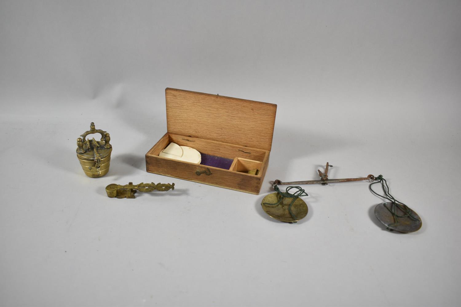 A Brass Sovereign and Half Sovereign Scale, A Cased Set of Graduated Weights and A Cased Jewellers