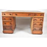 A Late 19th/Early 20th Century Mahogany Kneehole Writing Desk with Tooled Leather Top and Moulded