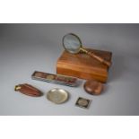 A Wooden Box Containing Miser's Purse, Gold Plated Australian Coins, Magnifying Glass, Coin Dish and
