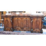 A Large Mid 19th Century Flame Mahogany Reverse Break Front Sideboard with Centre Drawer Over