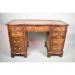 A Mid 20th Century Serpentine Fronted Kneehole Desk with Tooled Leather Writing Surface, Centre