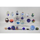 A Collection of Various Coloured Glass Paperweights