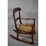 A Late 19th/Early 20th Century Cane Seated, Child's Rocking Armchair