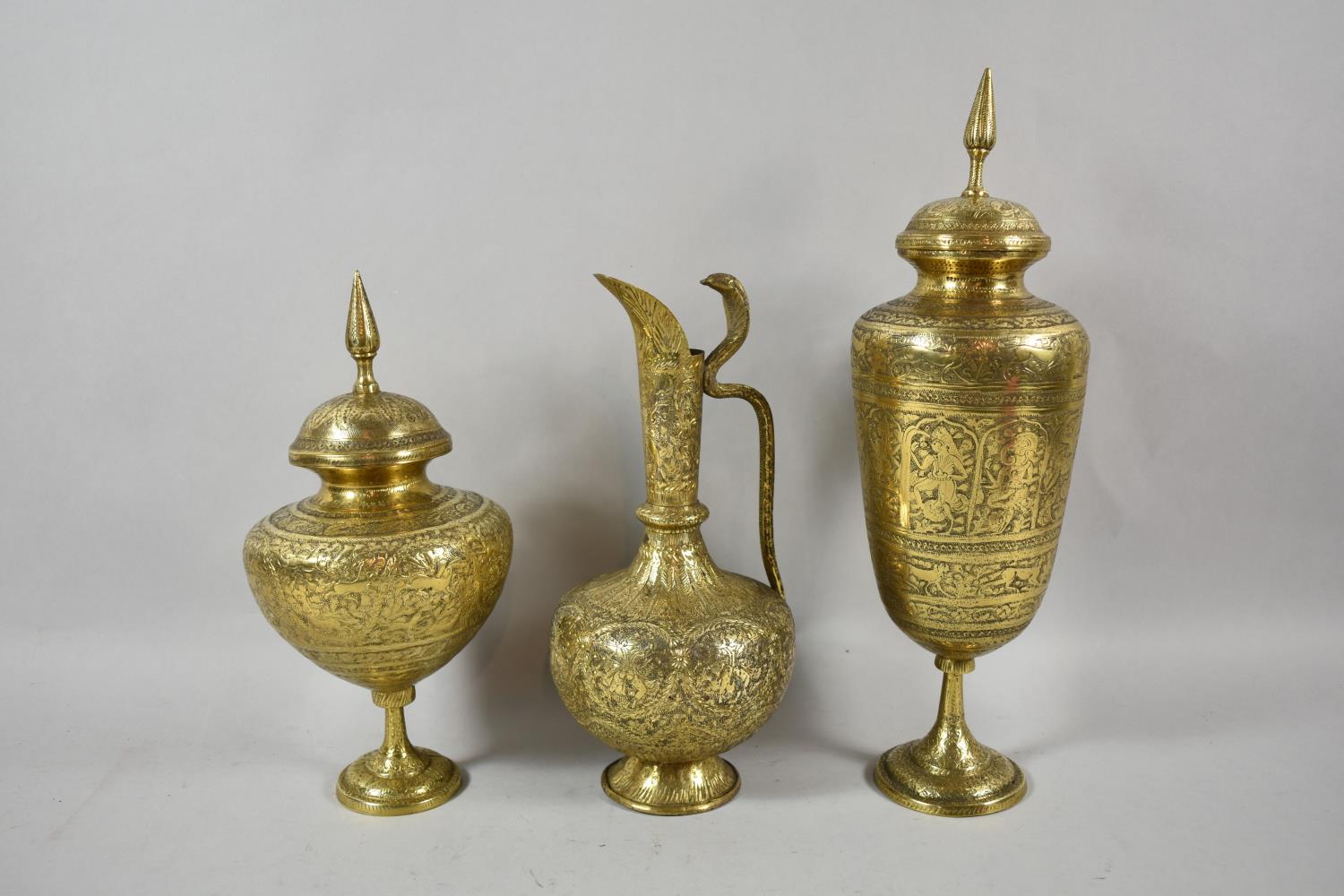 A Collection of Indian Brass Temple Vases and Jugs Decorated with Hindu Gods, The Tallest 35.5cm