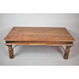 A Far Eastern Metal Mounted Rectangular Wooden Coffee Table on Turned Supports, 110cm wide