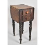 A 19th Century Mahogany Drop Leaf Two Drawer Work Table with Turned Supports in Need of Full