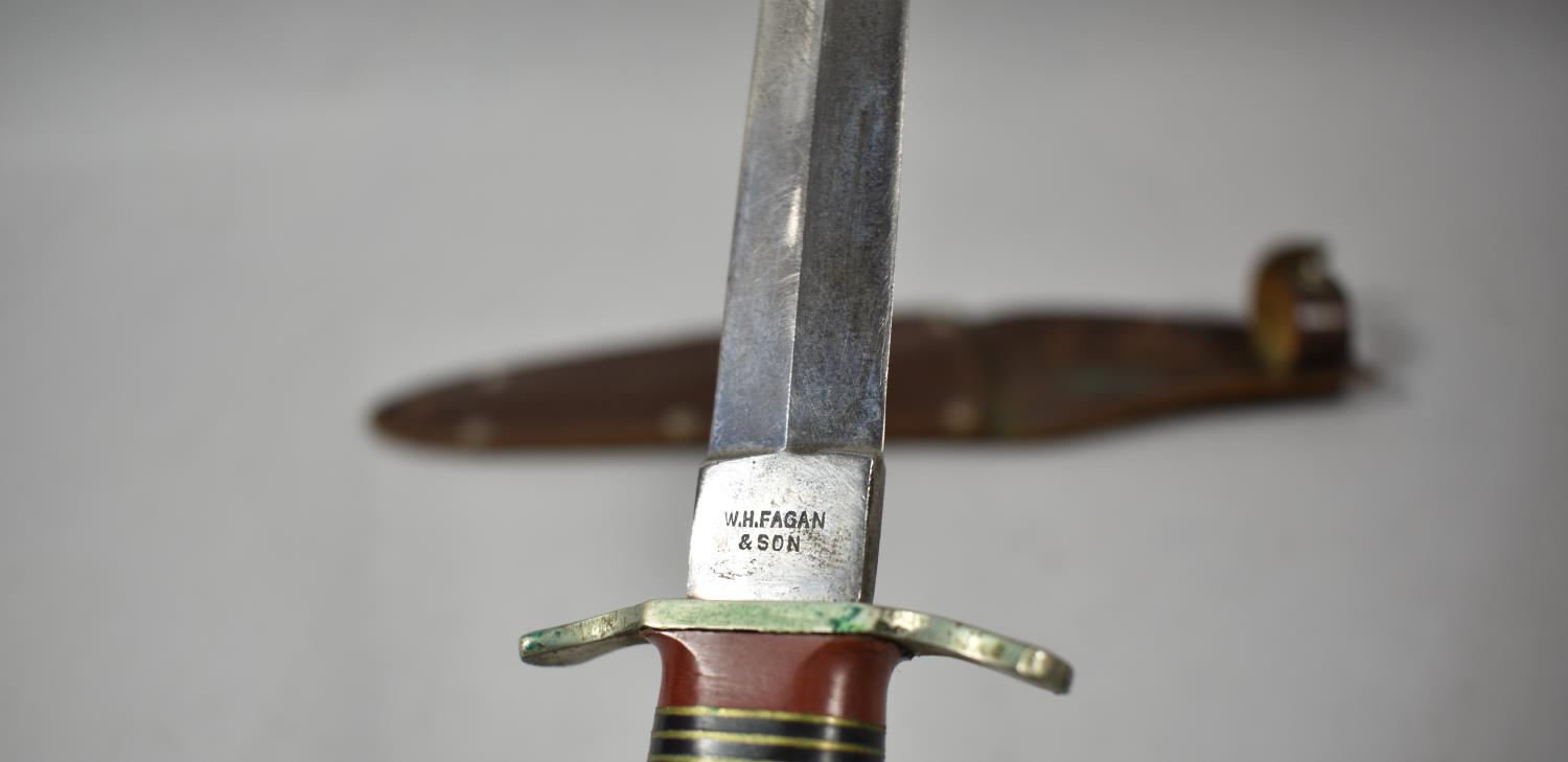 A WWII Commando Dagger by Fagan and Son., Sheffield Together with Leather Scabbard - Image 5 of 5