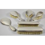 A Collection of Six Silver Plated Dressing Table Brushes and Mirror