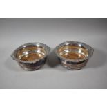 A Pair of Silver Plated Bottle Coasters, 16.5cm diameter