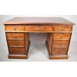 A Late 19th/Early 20th Century Mahogany Kneehole Desk with Centre Drawer Flanked by Four Graduated