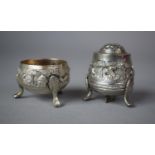 A Low Grade Indian Silver Two Piece Cruet Decorated in Relief with Animals and Birds on Three