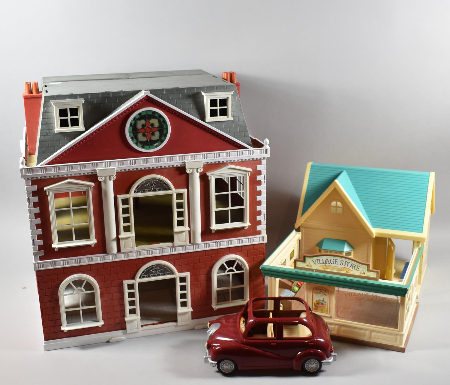 A Sylvanian Families Dolls House, Model Car and Village Store, Dolls House 47cm wide