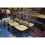 A Set of Six Rush Seated Ladder Back Dining Chairs