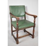 A Mid 20th Century Oak Framed Leather Upholstered Armchair With Brass Studwork