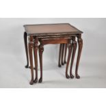 A Mid 20th Century Nest of Three Mahogany Table, the Largest 57cm wide