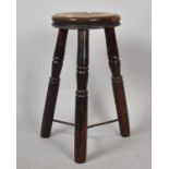 A Vintage Circular Topped Three Legged Stool with Iron Stretchers, 27cm Diameter Top