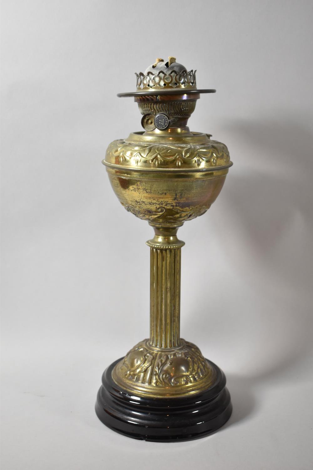 A Late 19th/Early 20th Century Pressed Brass Oil Lamp with Ribbed Column Support and Circular