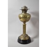 A Late 19th/Early 20th Century Pressed Brass Oil Lamp with Ribbed Column Support and Circular