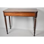 A 19th Century Mahogany Lift Top Tea Table on Tapering Turned Supports, 91cm wide