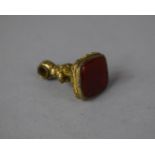 A Gilt Polished Stone Fob, 3cm high