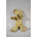 A Small Plush Teddy Bear with Metal Ear Stud, 33cm High