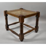 A Rectangular Oak Framed Cane Topped Stool, 34cm wide