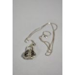 A Silver Novelty Pendant in the Form of Hinged Opening Handbag on Silver Chain