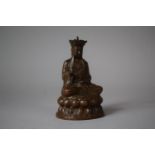 A Patinated Bronze Study of Chinese Scholar, Xuanzang, Seated on Lotus Throne, 10cm high