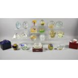 A Collection of Various Coloured Glass Paperweights