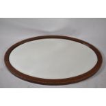 An Edwardian Inlaid Mahogany Framed Oval Wall Mirror, 82cm wide