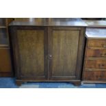 An Edwardian Mahogany Shelved Side Cabinet with Panelled Doors and Bracket Feet, 101cm wide