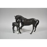 A Beswick Black Beauty and Foal