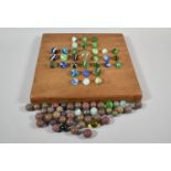 A Collection of Mixed Vintage Small Marbles, Together with a Square Wooden Solitaire Board, 23cm