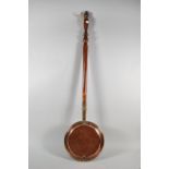 A 19th Century Copper Bed Warming Pan with Turned Wooden Handle