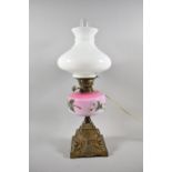 A Late 19th Century Gilt Metal Based Oil Lamp with Opaque Coloured Glass Reservoir Having Floral